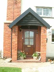 Photograph of the front door to The Cayo